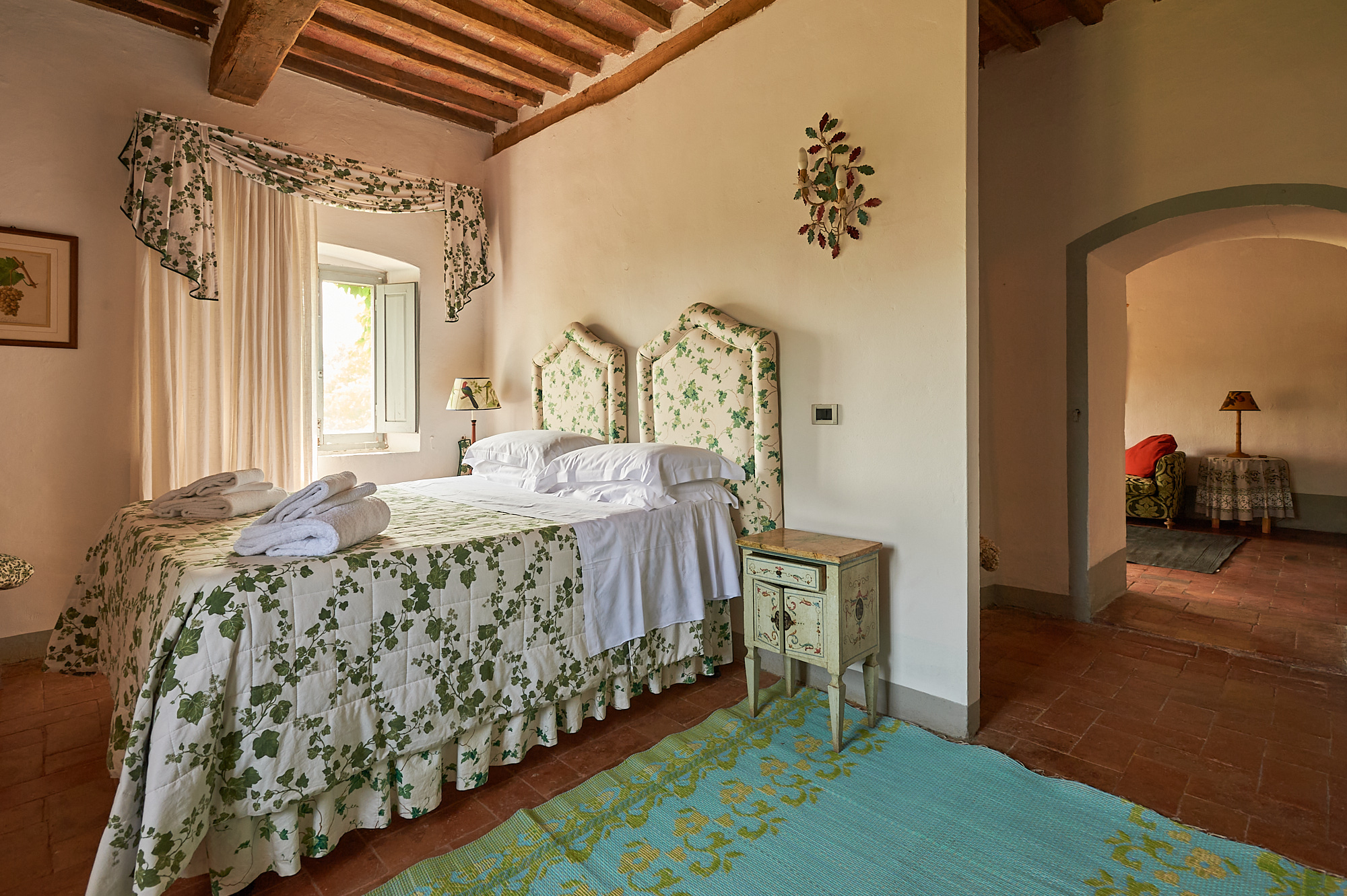 Casa Bianca bedroom with floral linens