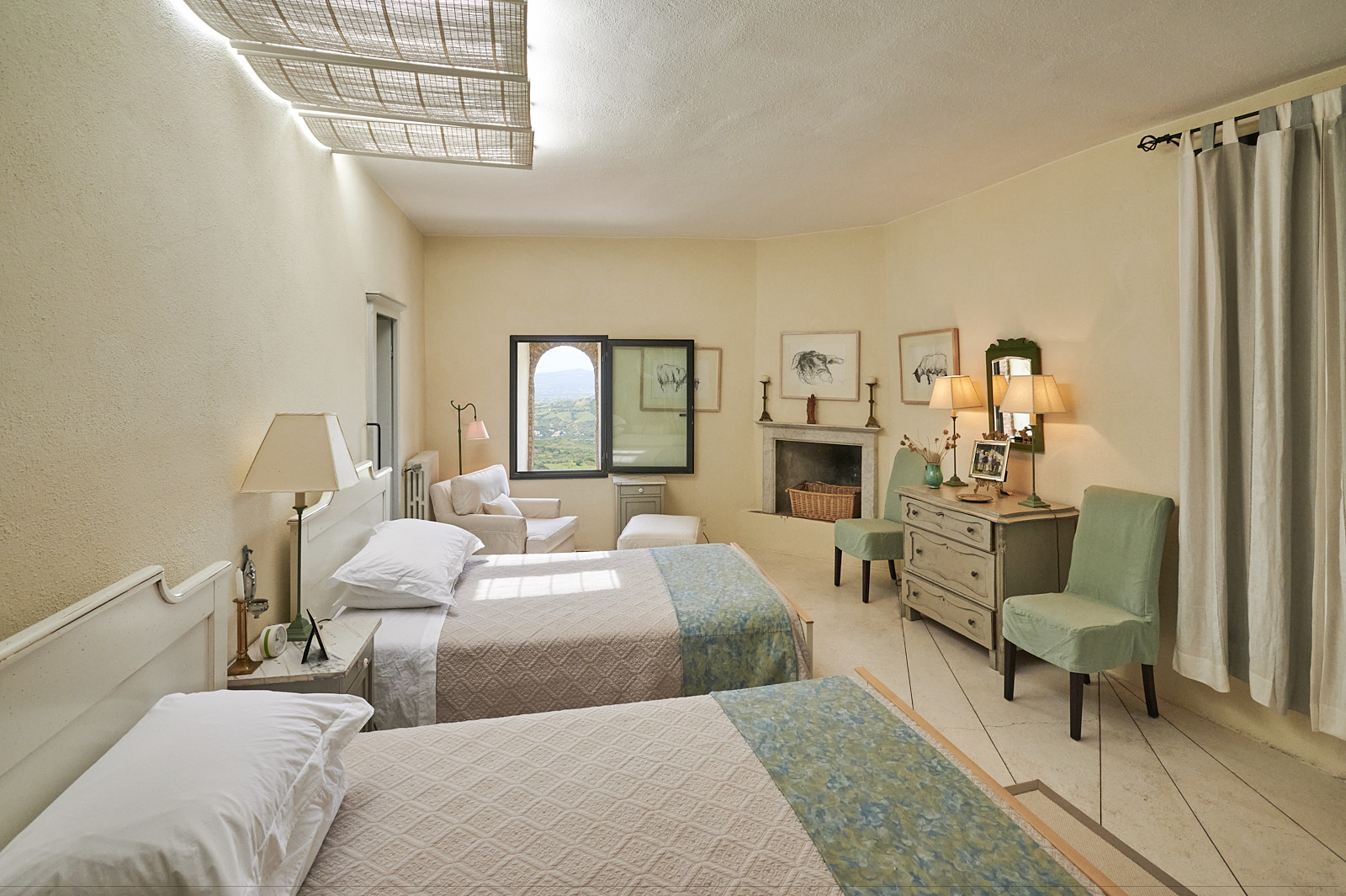 Cana twin bedroom with fireplace